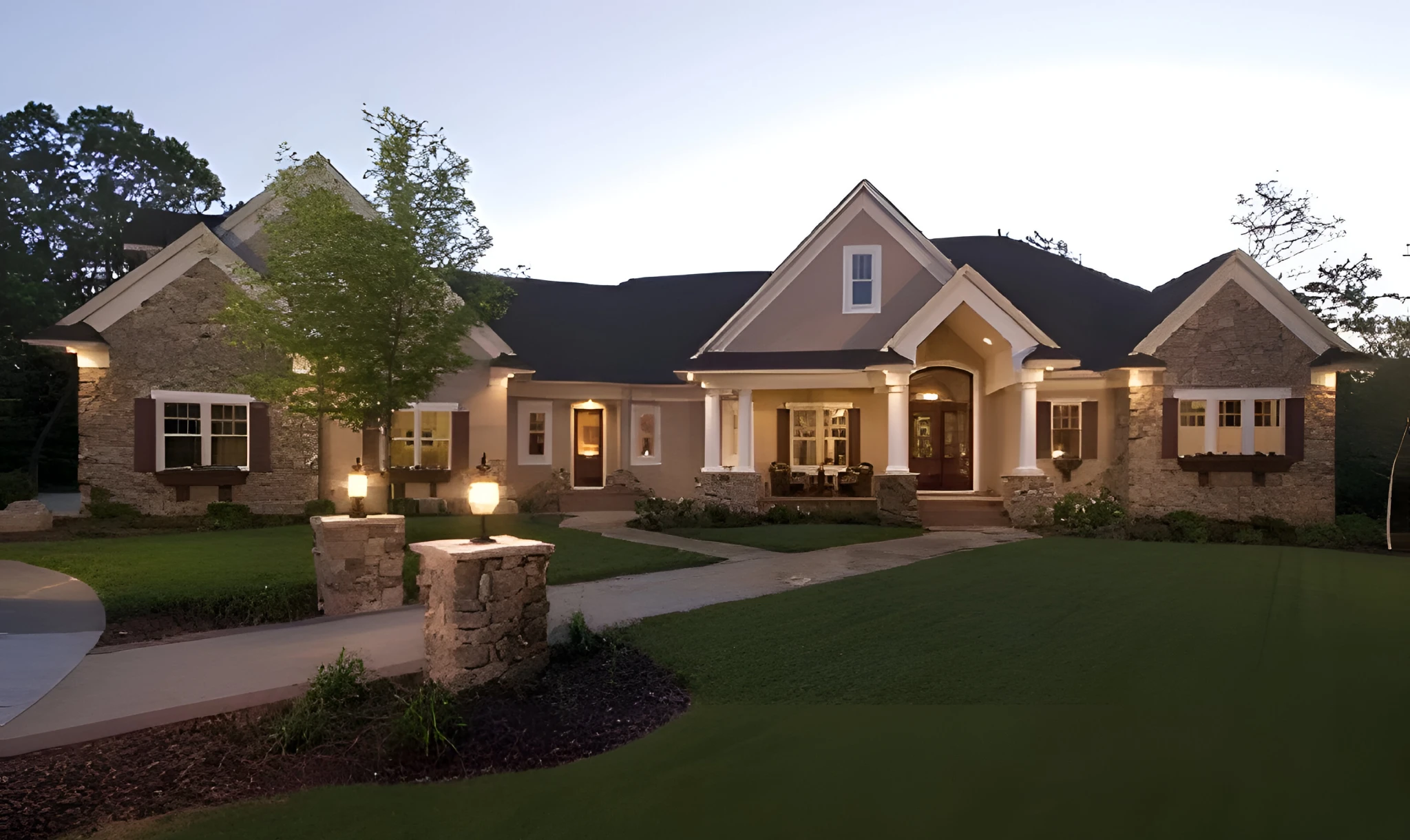 Craftsman custom home with tapered columns and exposed rafter tails